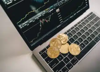 Coins On Top of a Laptop